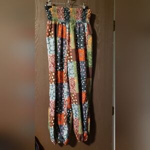 SHEIN pants with several 'patch Work' Designs. Size